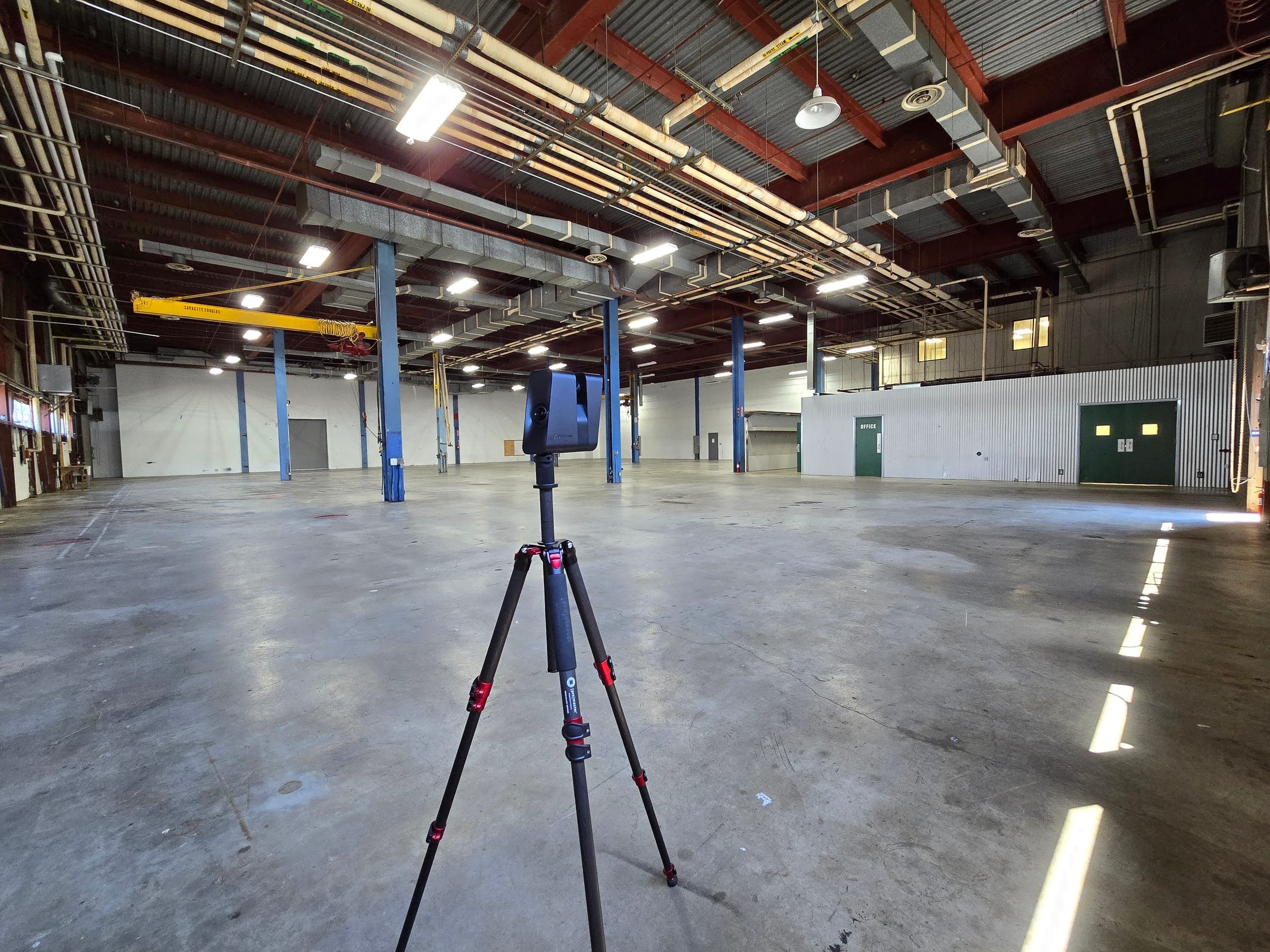 Matterport Pro3 3D scanner on a tripod capturing a warehouse, vallejo, ca in Northern California